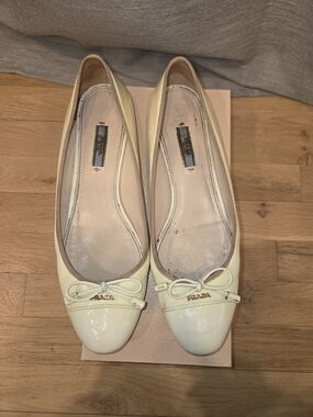 Prada Cream White Beige Patent Leather Bow Ballet Flats Gold Logo Hardware EU 41
